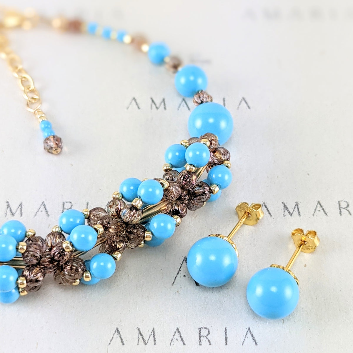 Turquoise blue crystal pearl studs