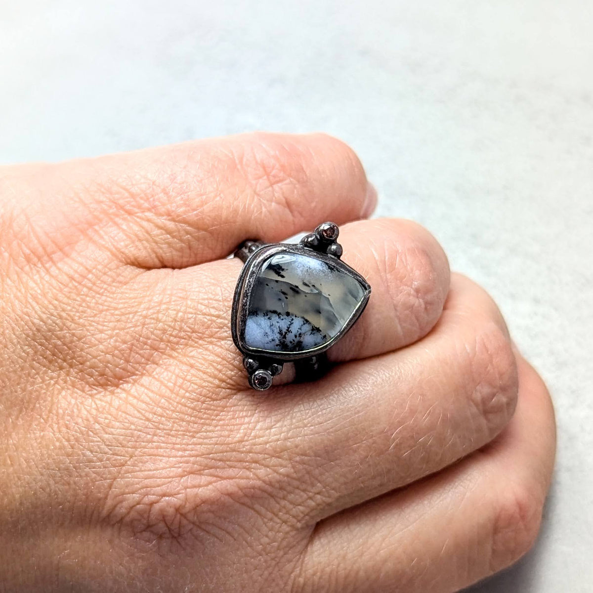 Dendritic agate silver ring with umber accent