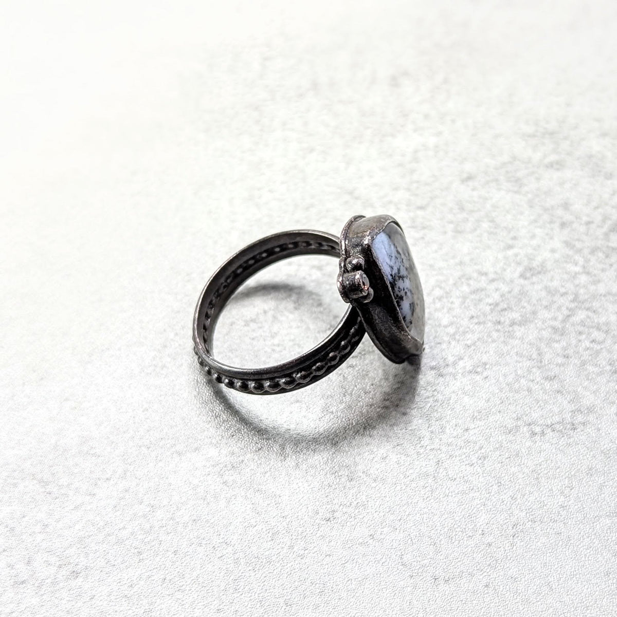 Dendritic agate silver ring with umber accent