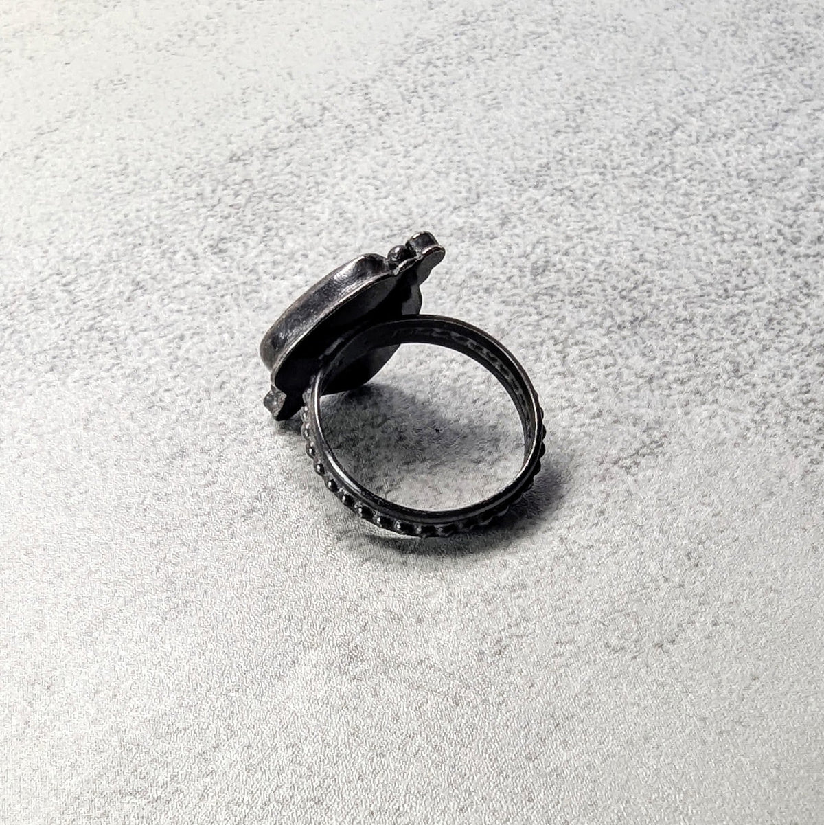 Dendritic agate silver ring with umber accent
